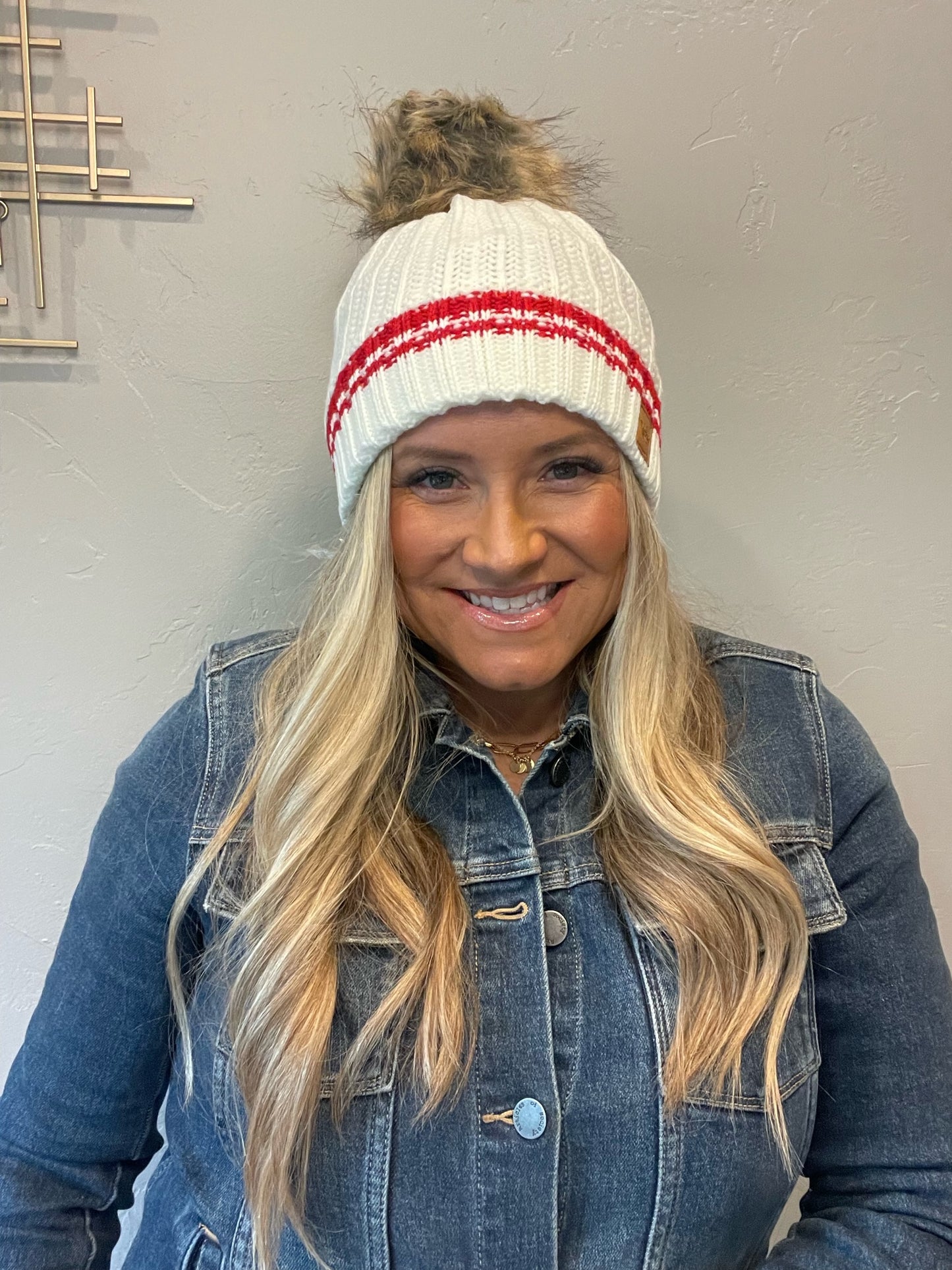 Adorable fleece lined cream knit beanie with red stripe & pom accent