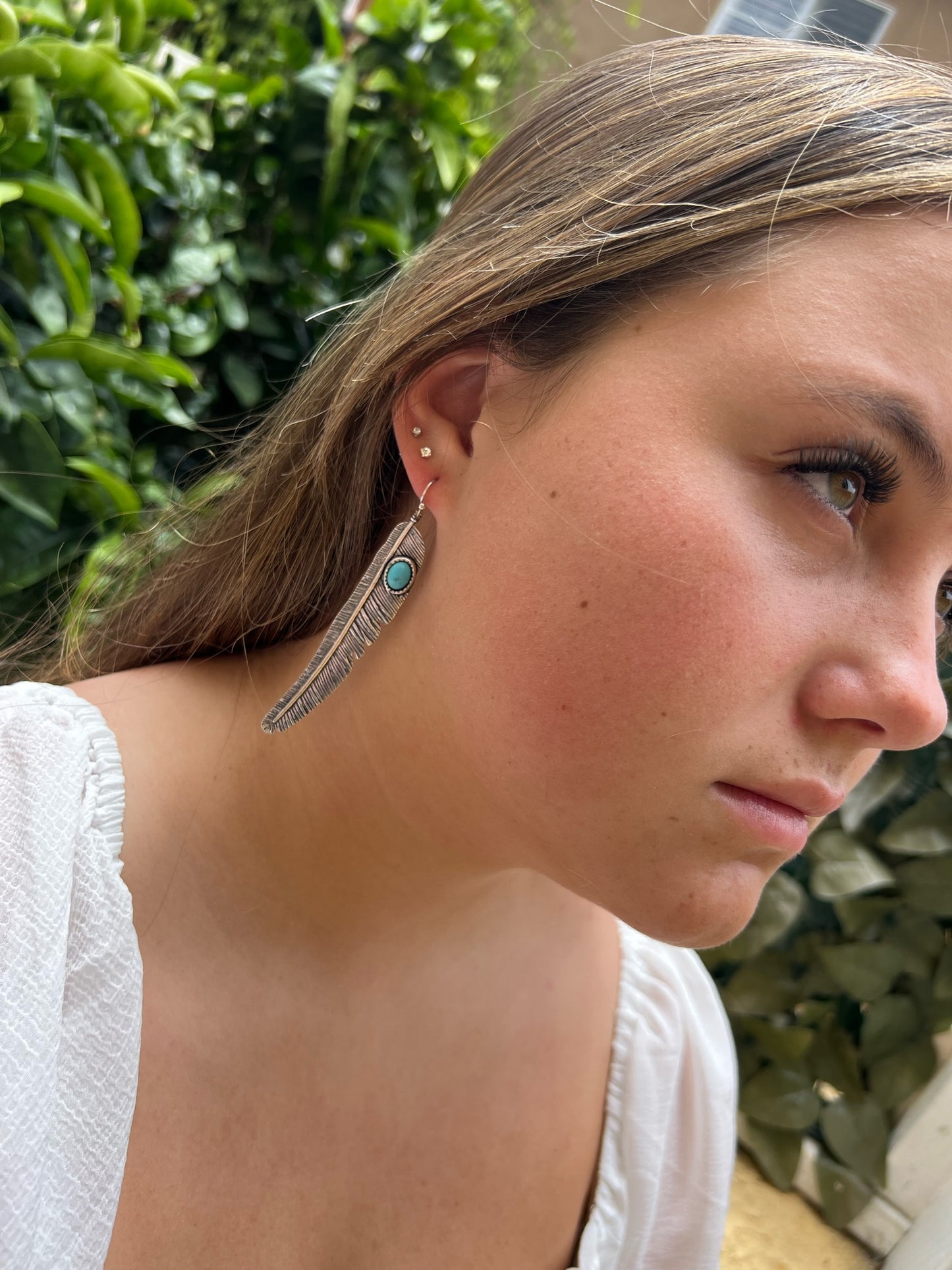 Dangling Feather Earrings with Turquoise Stone Accent